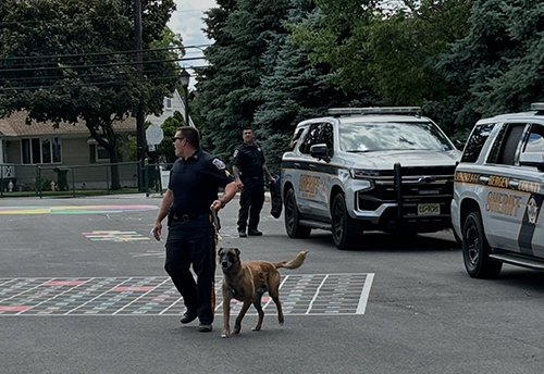 K-9 officer walking dog