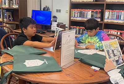 Students reading books at the local library