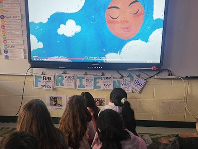 4th grade students watching a video in the classroom