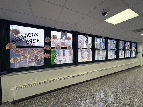 Thanksgiving Day parade projects displayed on the school windows