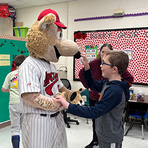 Stident touching Jack the Jackal's nose