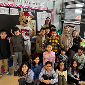 Students and teacher standing next to Jack the Jackal