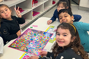 Students playing a colorful board game