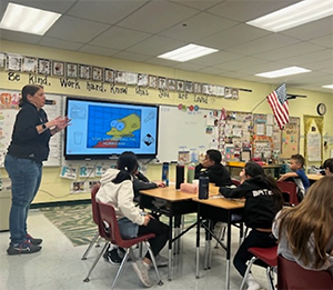 Speaker from Veolia Water Company in front of 4th graders