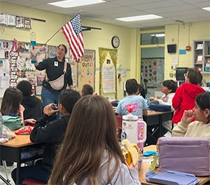 Speaker from Veolia Water Company giving a demonstration to 4th graders