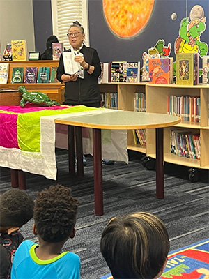 Janet Wong reading to students